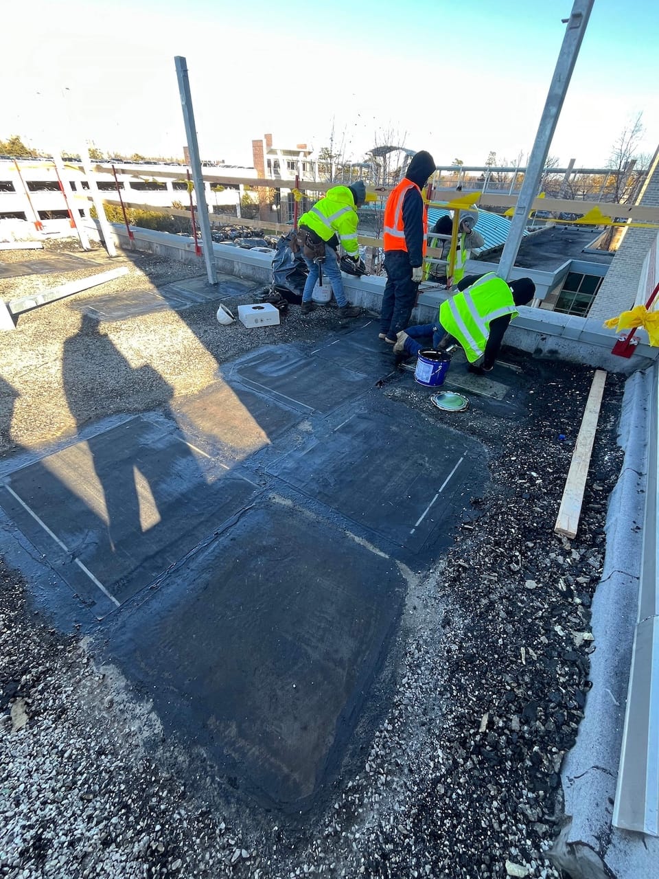 Panda crew in high-visibility vests working on the facility’s roof