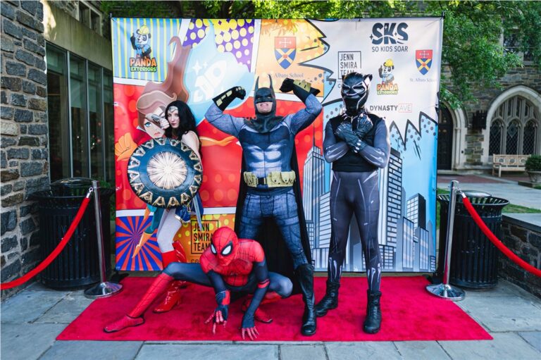 Superheroes on the red carpet at a So Kids Soar event