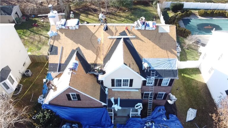 Panda Exteriors crew replacing the roof of a two-story home